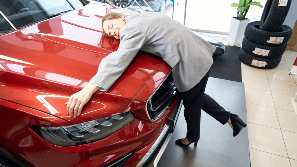 Woman hugging a car 