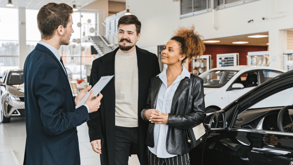 Couple buying luxury car