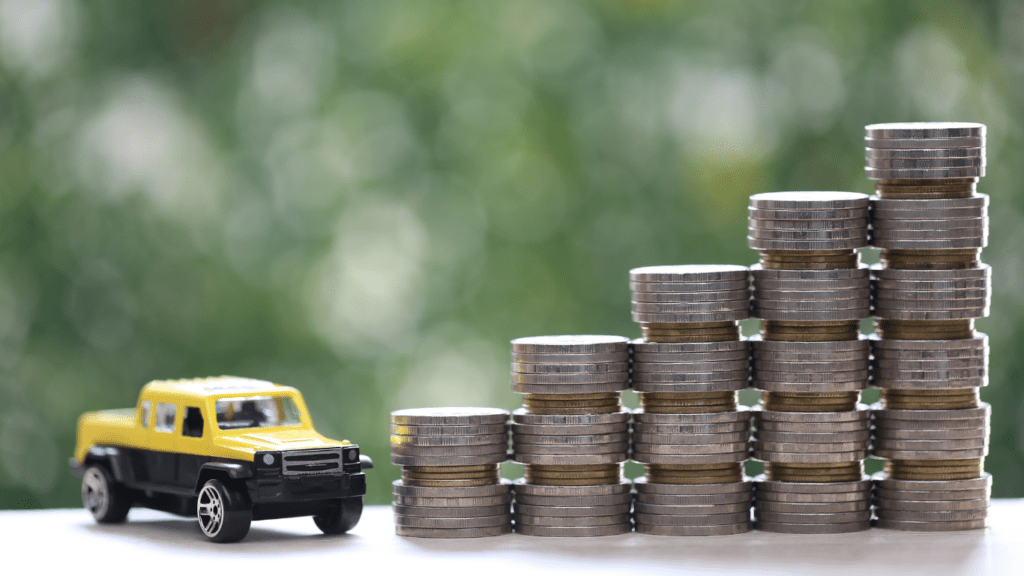 Stack of coins  and car 